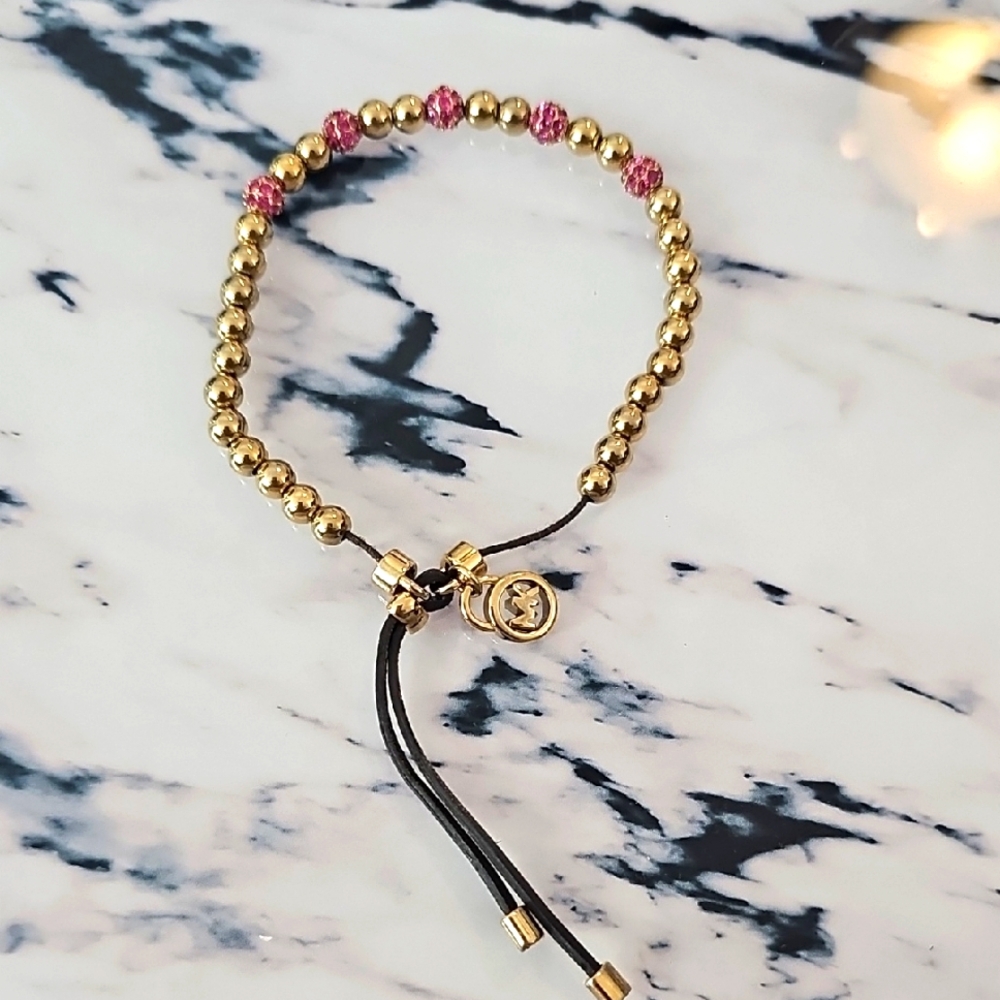 Michael Kors gold beaded bracelet with pink crystals
